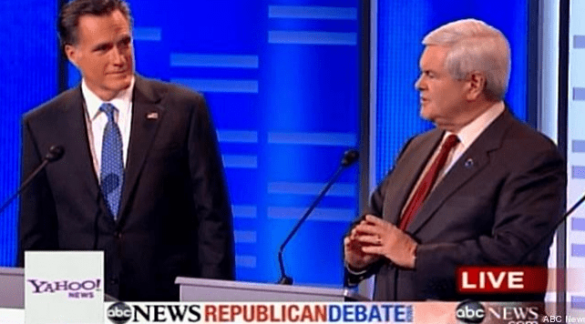 Romney and Gingrich participate in a Republican debate, discussing key issues. The image shows a moment of contention between the candidates.