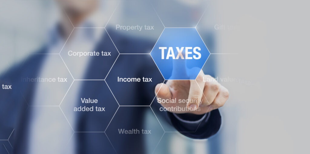 Businessman showing concept of taxes