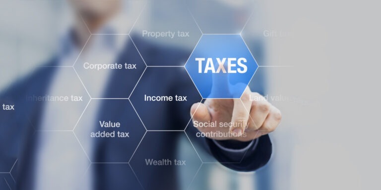 Businessman showing concept of taxes