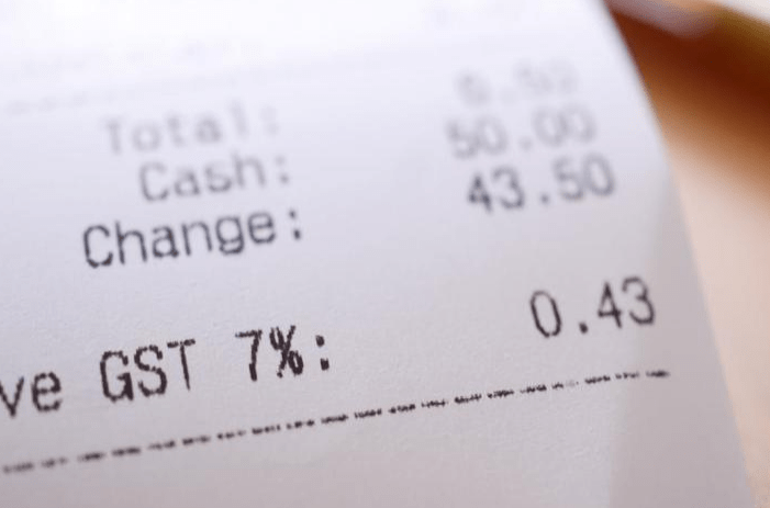 Receipt showing a total of $6.50, cash paid of $50.00, change of $43.50, and GST of 7% totaling $0.43. Relevant for tracking expenses.