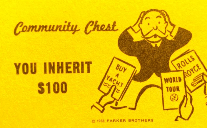 Community Chest card from Monopoly showing "You Inherit $100" with an amused character holding signs for a yacht, Rolls Royce, and a world tour.