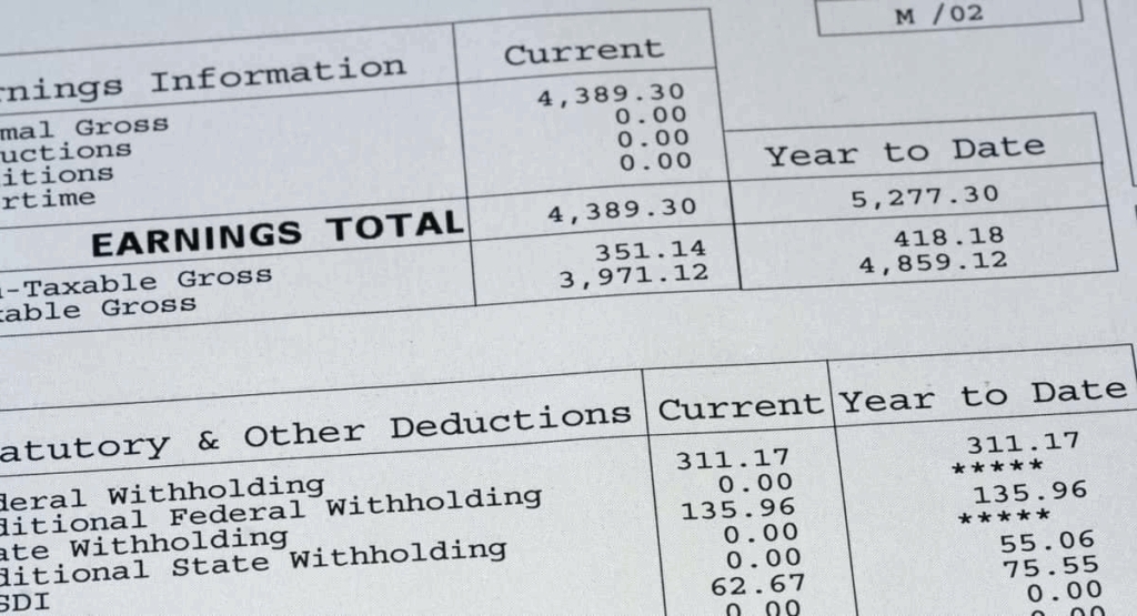 Earnings statement detailing total earnings, deductions, and year-to-date amounts. Key figures include current earnings of $4,389.30.