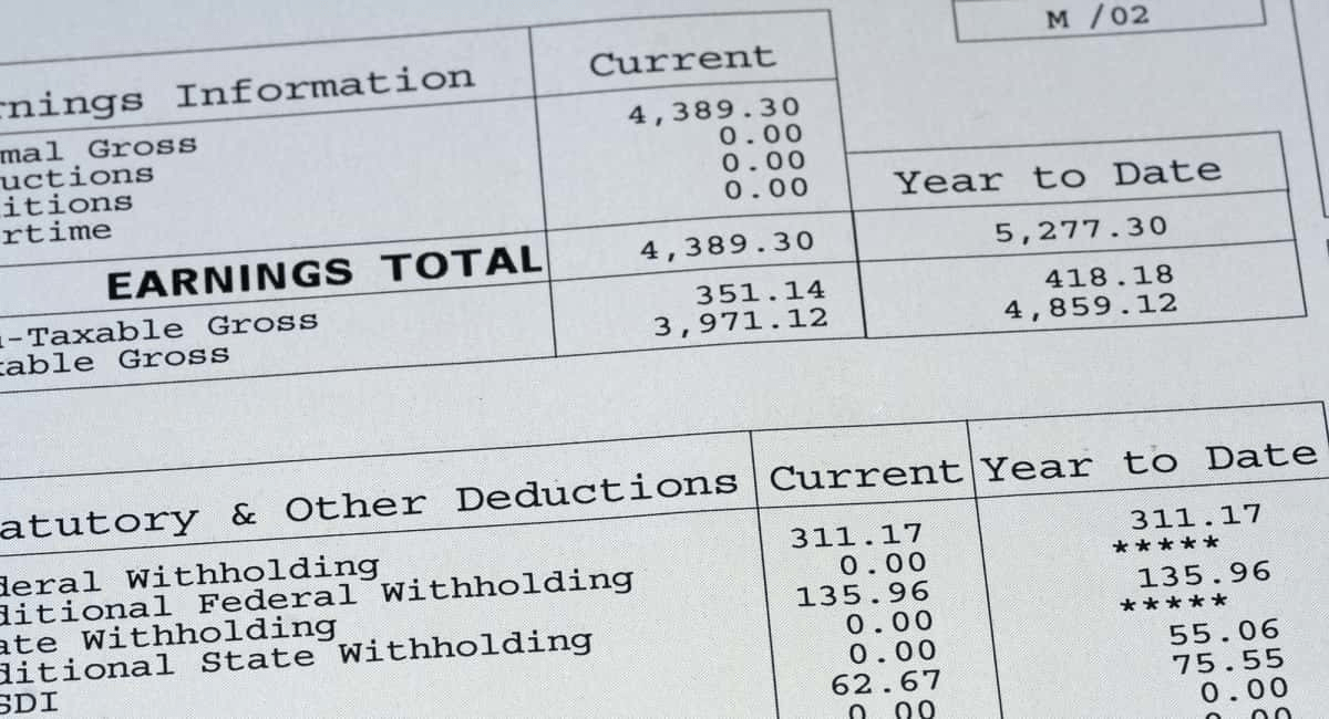 Earnings statement detailing total earnings, deductions, and year-to-date amounts. Key figures include current earnings of $4,389.30.