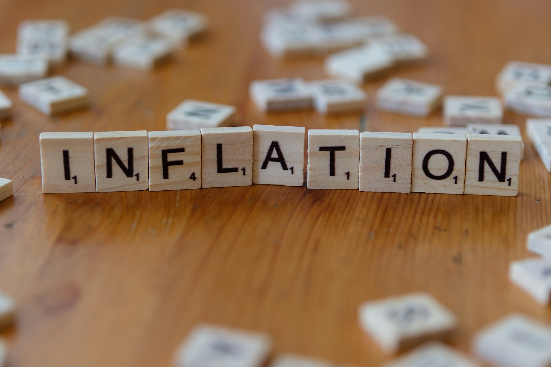 Inflation spelled out in Scrabble tiles. Photo by Markus Winkler on Unsplash